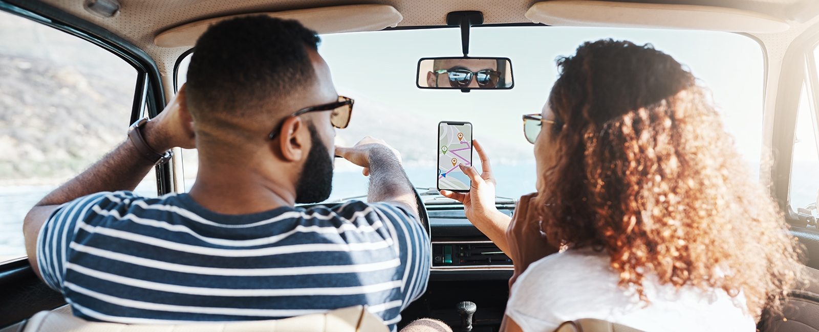 Stock couple using map mobile