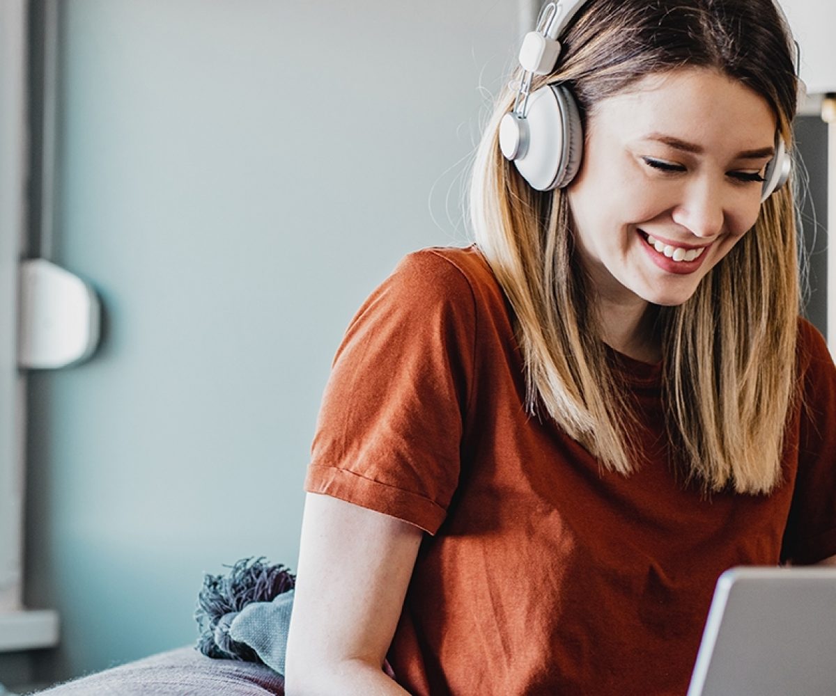Stock woman laptop headphones