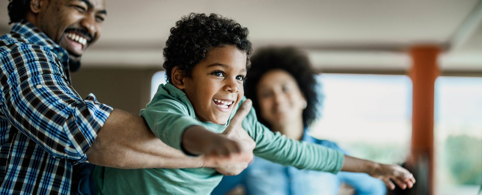 Stock family playing laughing
