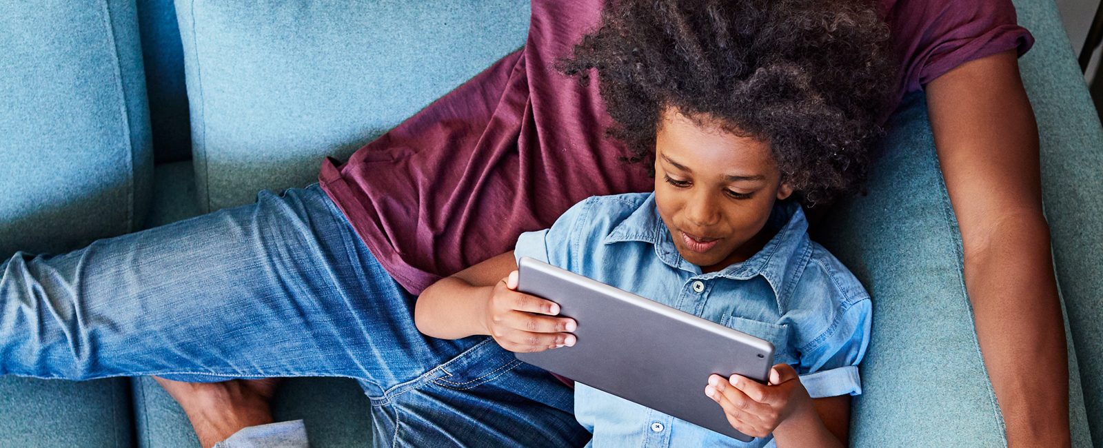 Stock father and son on tablet