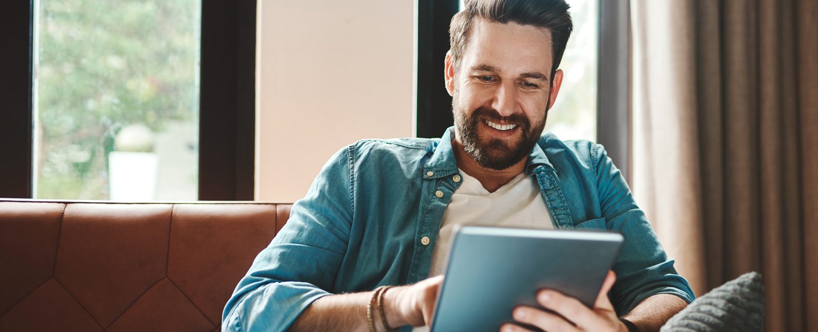 Stock man using tablet