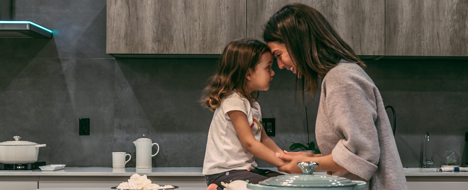 Stock mother daughter in kitchen
