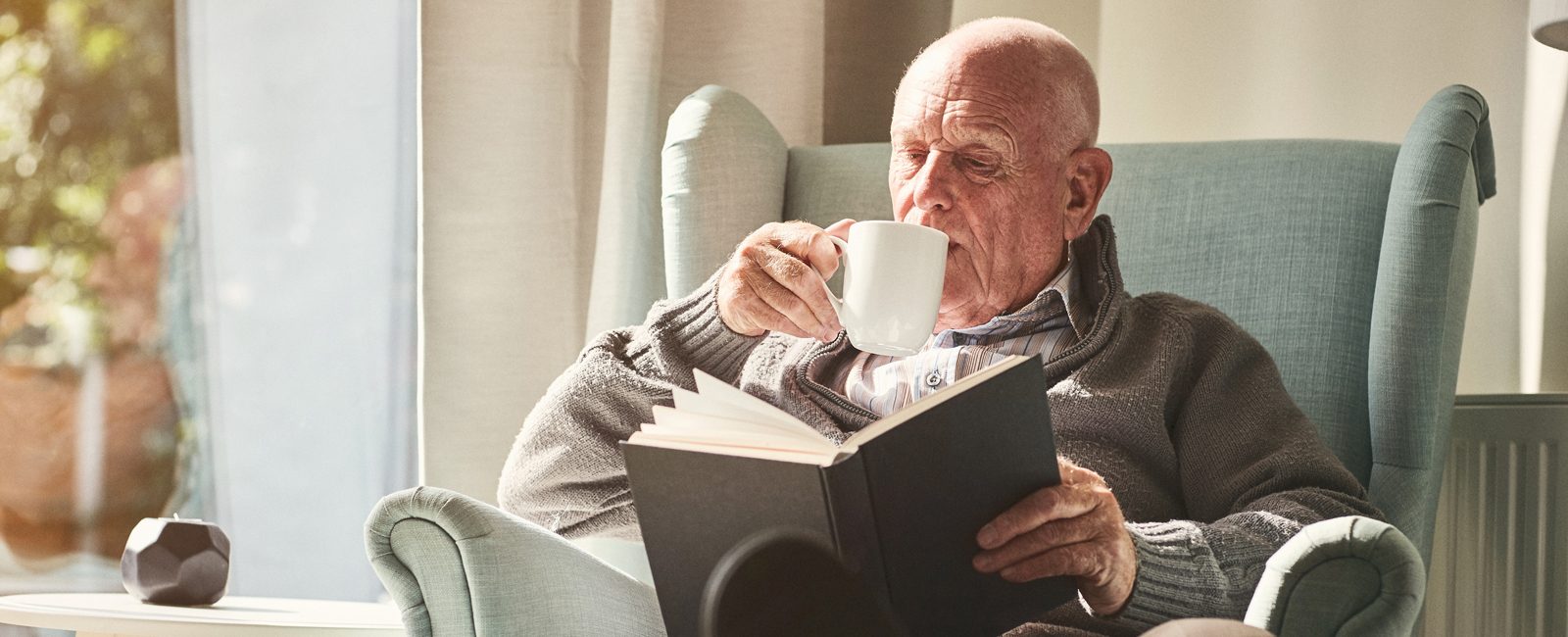 Stock older man reading
