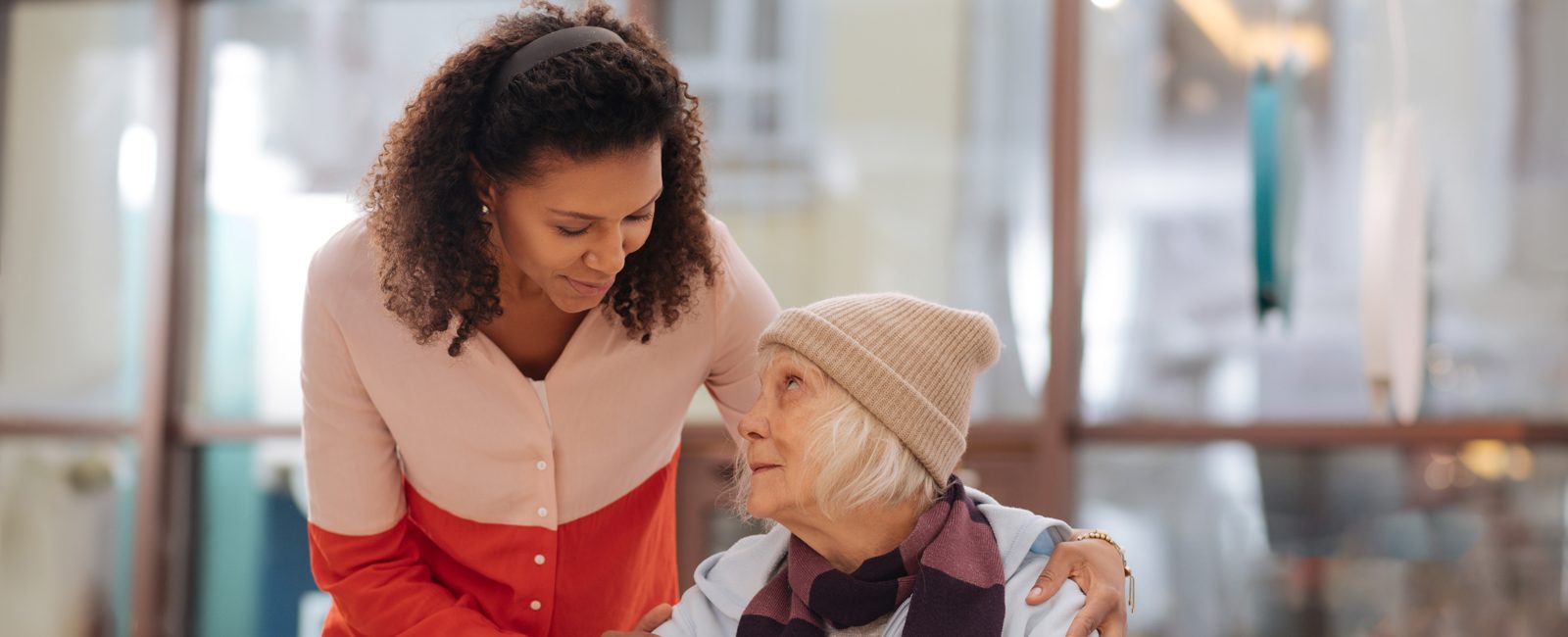 Stock woman helping older woman