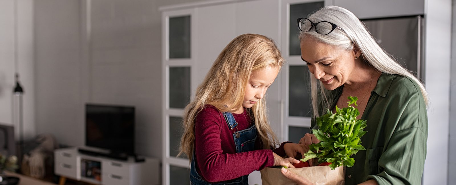 Stock women and child in kitchen