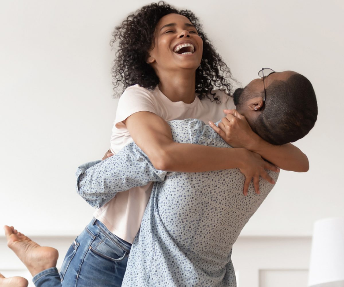 Stock couple hugging playing